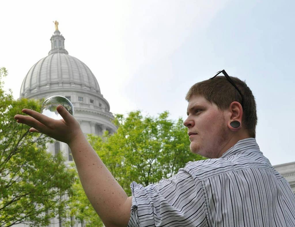 Aman holding a crystal ball